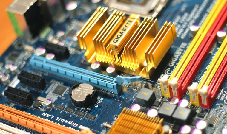 Detailed close-up of a computer motherboard showcasing various electronic components.